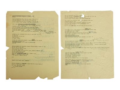 The two sheets of yellowed paper contain three typewritten drafts of the iconic song.