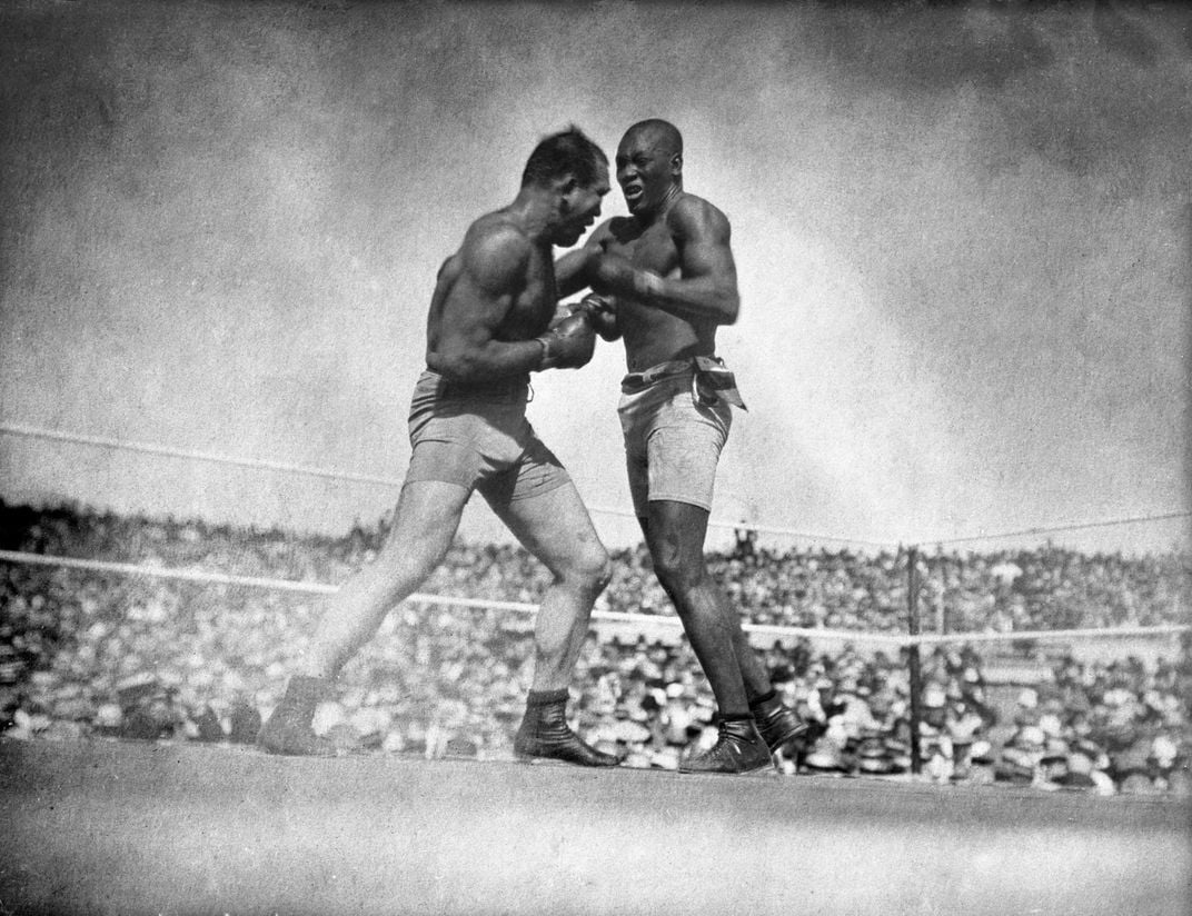 Jack Johnson (right) defeated Jim Jeffries in a 1910 boxing showdown