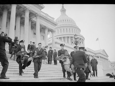Police remove peaceful protestors from a sit-in at the U.S. Capitol in 1965.