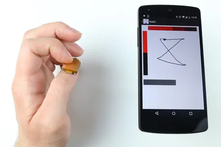 This track pad fits on your thumbnail, and can be customized with nail stickers. 