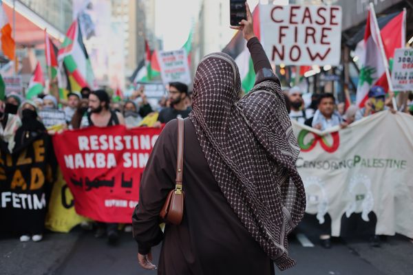 A Muslim woman leads a march thumbnail