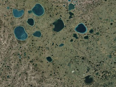 The small lakes that dot Russia's Yamal Peninsula were likely formed in the same was as the two strange holes.