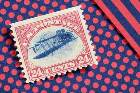 The &quot;Inverted Jenny,&quot; 1918, one of the rarest and most valuable stamps in the world, celebrates the first air mail in the U.S.&mdash;by depicting an inadvertently upside-down airplane.