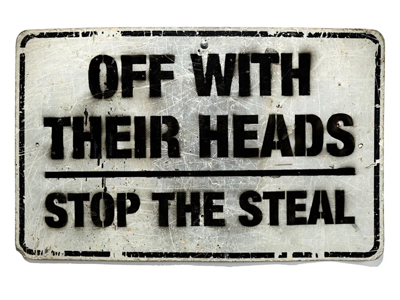 A road sign reading "Off with their heads | Stop the steal"