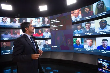 A professor teaches an online class with students from around the world.