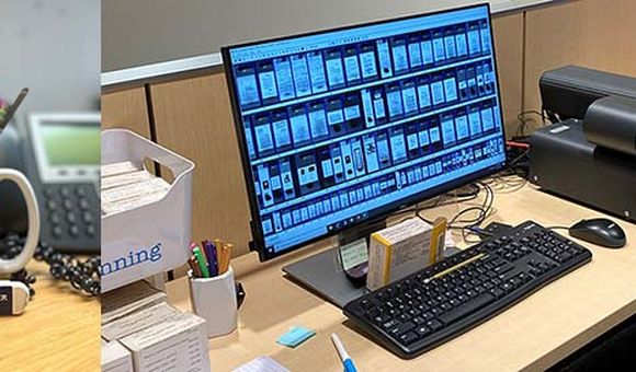 Color image of white erasers in blue and white sleeves in front of a green and white mug full of pencils with a phone and jar of pens in the background next to a color image of a computer and microfilm scanner with images of scans on the screen.