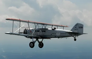 Addison Pemberton pilots his restored Boeing 40C earlier this year. On the September 10 flight, the author rode in the compartment beneath the upper wing.