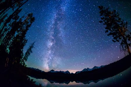 Little Redfish Lake at night with the Sawtooth Mountains in the background.