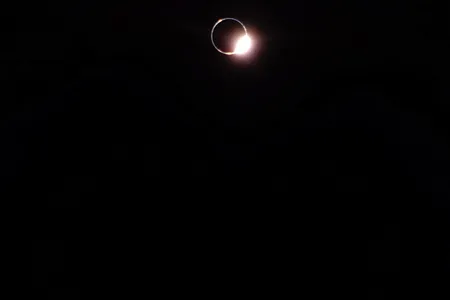 A &quot;diamond ring&quot; appears around the Earth, as seen by the Blue Ghost lander on the moon.