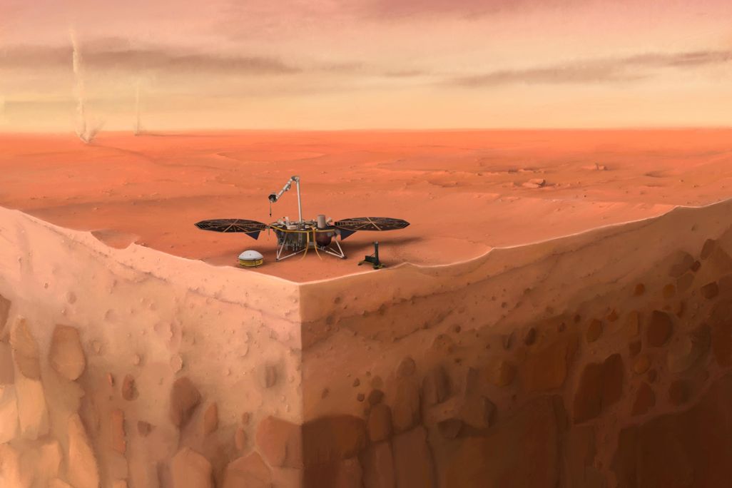 An artist's rendering of InSight. It looks like the robot is sitting atop a piece of land that has been sliced to look like a corner, revealing the layers underneath the surface. The background depicts Mars' red, rocky surface before a yellow sky.
