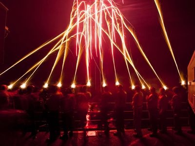 U.S. Sailors ring in the new year aboard the aircraft carrier USS Carl Vinson (CVN 70) with a qualification fire of pencil flares while under way in the Pacific Ocean in the first time zone west of the International Date Line Jan. 1, 2010.  Carl Vinson and Carrier Air Wing (CVW) 17 are on a deployment to the U.S. 7th Fleet area of responsibility. (DoD photo by Mass Communication Specialist 2nd Class James R. Evans, U.S. Navy/Released)