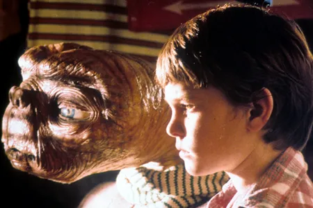 E.T. looks out the window with Elliott (Henry Thomas) in a scene from the 1982 movie.&nbsp;