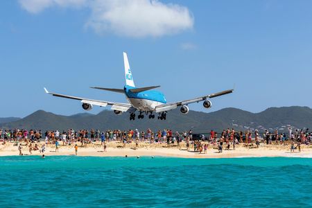 A KLM 747 on approach to Princess Juliana Airport adds another tourist attraction to St. Maarten’s aqua waves. 