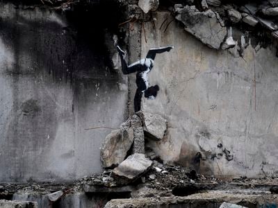 The mural was painted on the side of a building damaged by Russian airstrikes.&nbsp;