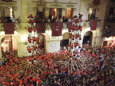 Teams compete to form the tallest human towers, called castells—a centuries-old activity that creates quite the spectacle in Catalan public spaces.