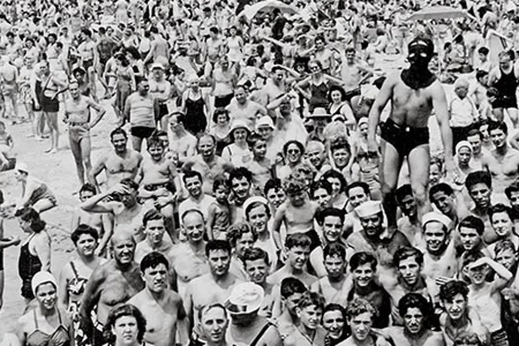 Weegee photo of masked man on Coney Island