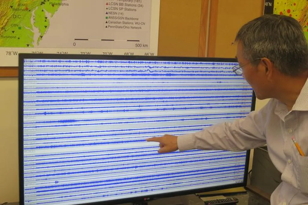 Seismologist Won-Young Kim looks at a computer