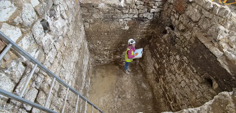 Archaeologists in cesspit