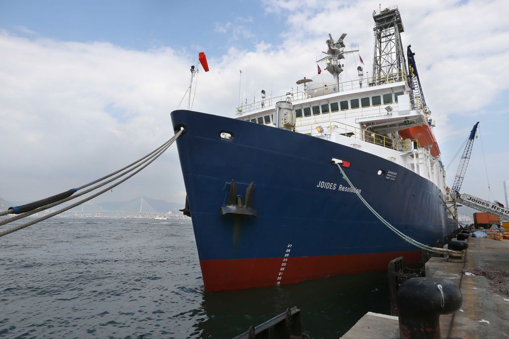 A large ship sits at a dock