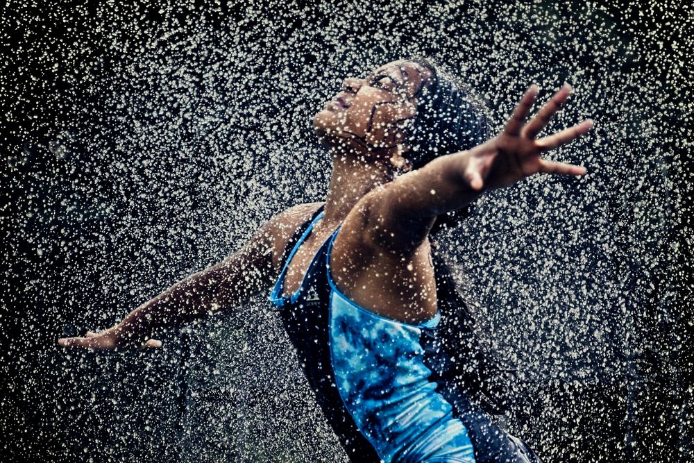A girl in sprinklers
