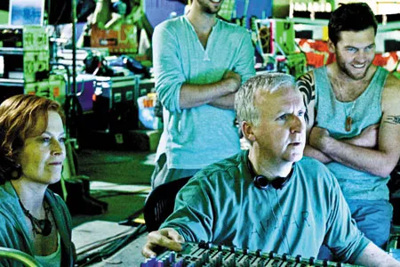 James Cameron, with Sigourney Weaver, Joel Moore and Sam Worthington, is in command on the set of Avatar.