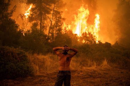 Wildfire during Greece&#39;s 2021 heatwave, which experts&nbsp;have linked to climate change