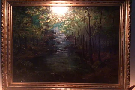 An image from the eBay listing for&nbsp;Forest With a Stream, which is attributed to&nbsp;Claude Monet