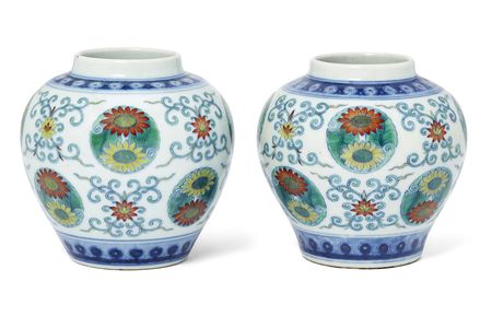 An associated pair of Chinese doucai "lotus and chrysanthemum" jars from the Qing Dynasty