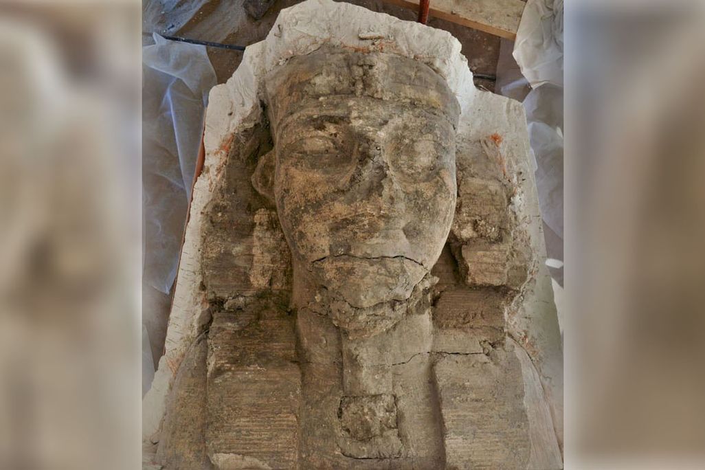 large stone head of man with egyptian headress