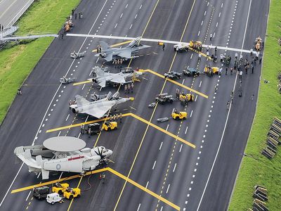 Military aircraft used Taiwan’s main highway as an airstrip during the annual Han Kuang defense exercises. Four sections of the freeway have been designated for emergency use.