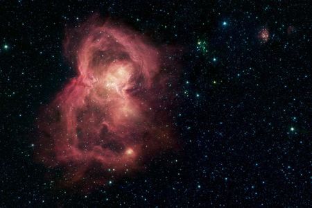 A nursery for hundreds of baby stars is revealed in this infrared image from NASA's Spitzer Space Telescope.