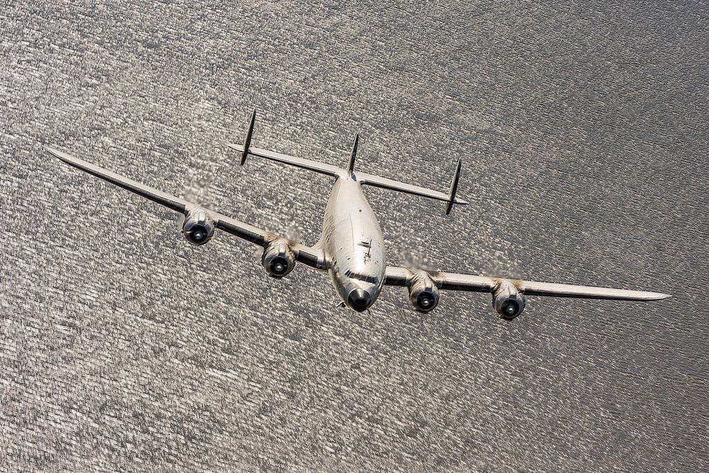 Lockheed Constellation over a lake in monochrome