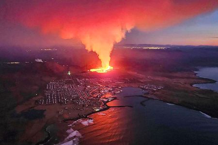 A volcanic eruption moves toward the outskirts of the evacuated town of Grindavik on Iceland&rsquo;s Reykjanes Peninsula.