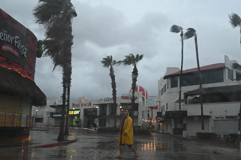 A man walks during a hurricane