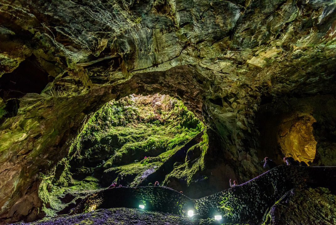 Exploring the Algar do Carvão lava caves, Terceira