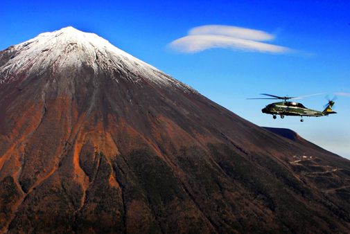 A U.S. Army Sikorsky helicopter backdropped by Japan's famous landmark.