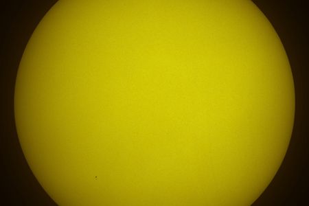 The NASA space shuttle Atlantis and the Hubble Space Telescope are seen in silhouette, side by side in this solar transit image made at 12:17p.m. EDT, Wednesday, May 13, 2009, from west of Vero Beach, Florida. The two spaceships were at an altitude of 600 km and they zipped across the sun in only 0.8 seconds.  Photo Credit: (NASA/Thierry Legault)