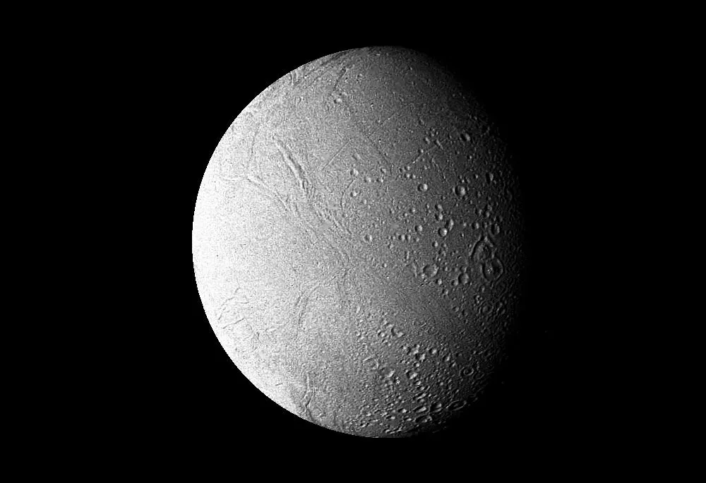 a cratered, spherical, white moon against a black background