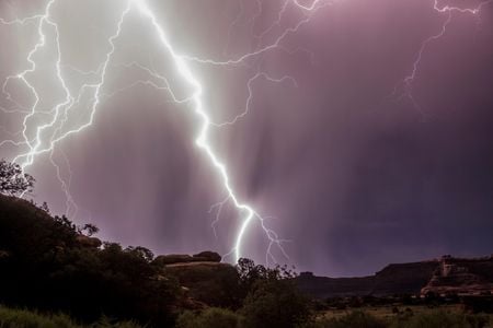Lightning crackles across the sky over Canyonlands National Park in Utah.