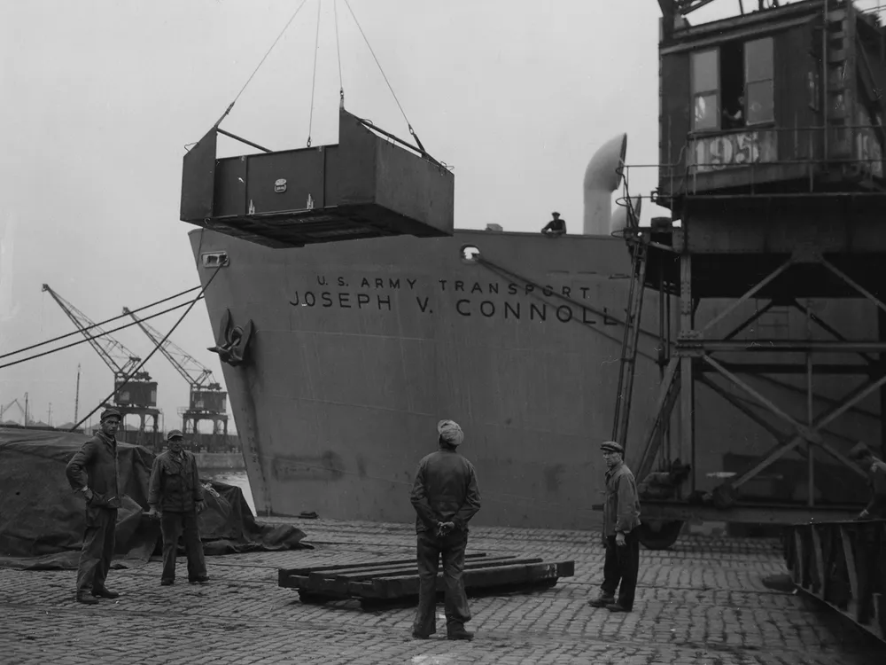 Caskets of American war dead are loaded onto the S.S. Joseph V. Connolly in Antwerp, Belgium, in September 1947.