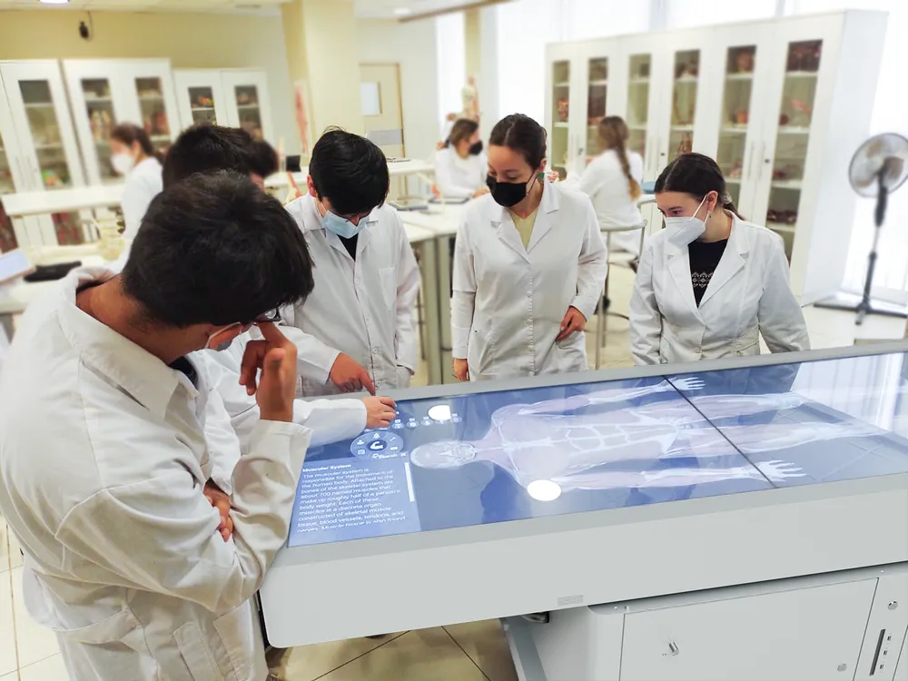 students stand around an Asclepius table