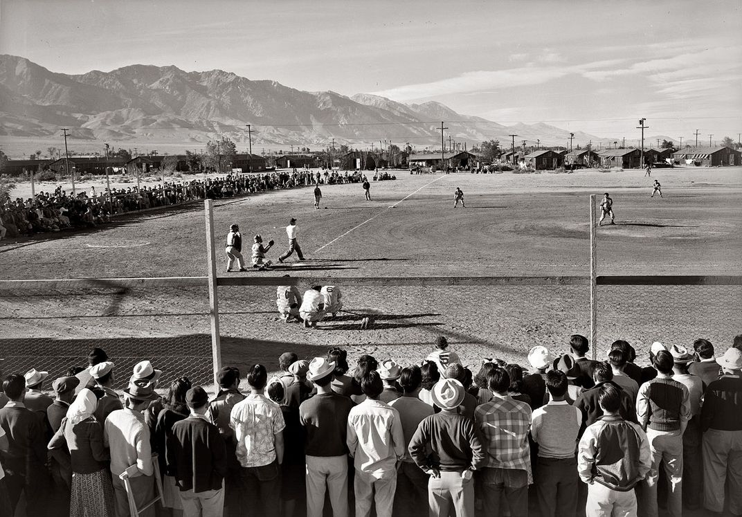 Japanese Americans attend a baseball game at the Manzanar incarceration camp in California in 1943.
