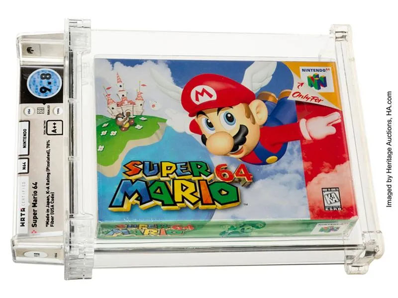 A video game cartridge in original packaging, with SUPER MARIO and Mario falling down from the sky on its front, encased in protective plastic and labeled with its rating