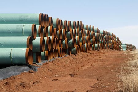Miles of pipe slated for the Keystone XL stacked in a field near Ripley, Oklahoma after construction stalled in 2012.