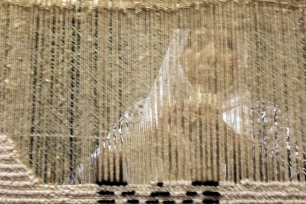woman weaving a Berber rug thumbnail