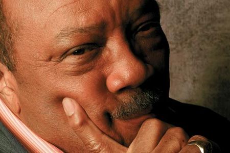 Jones (sporting Frank Sinatra's ring) has a hand in the Beijing Olympics as well as ongoing music and movies