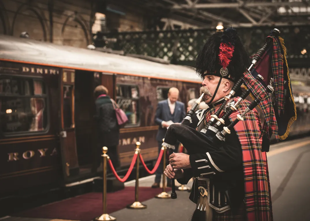 Traditional piper at the station with the Royal Scotsman
