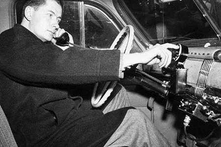 An engineer demonstrates a car phone five months before the historic first call on a competing company’s commercial mobile telephone service in 1946.