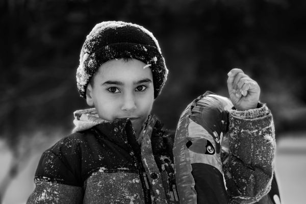 A Boy Playing with Snow thumbnail
