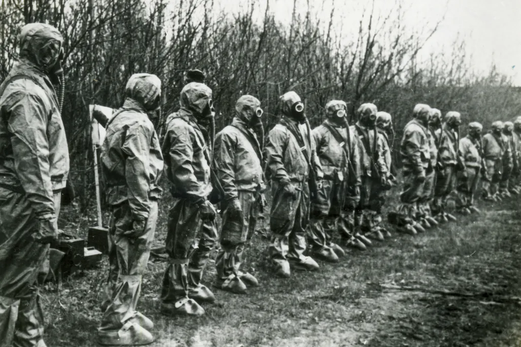 Masked liquidators in line to deal with the Chernobyl plant disaster